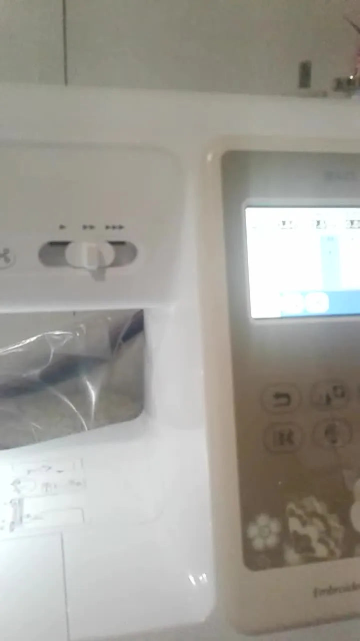 A Brother SE625 sewing and embroidery machine powered on with the LCD screen ready for setup.