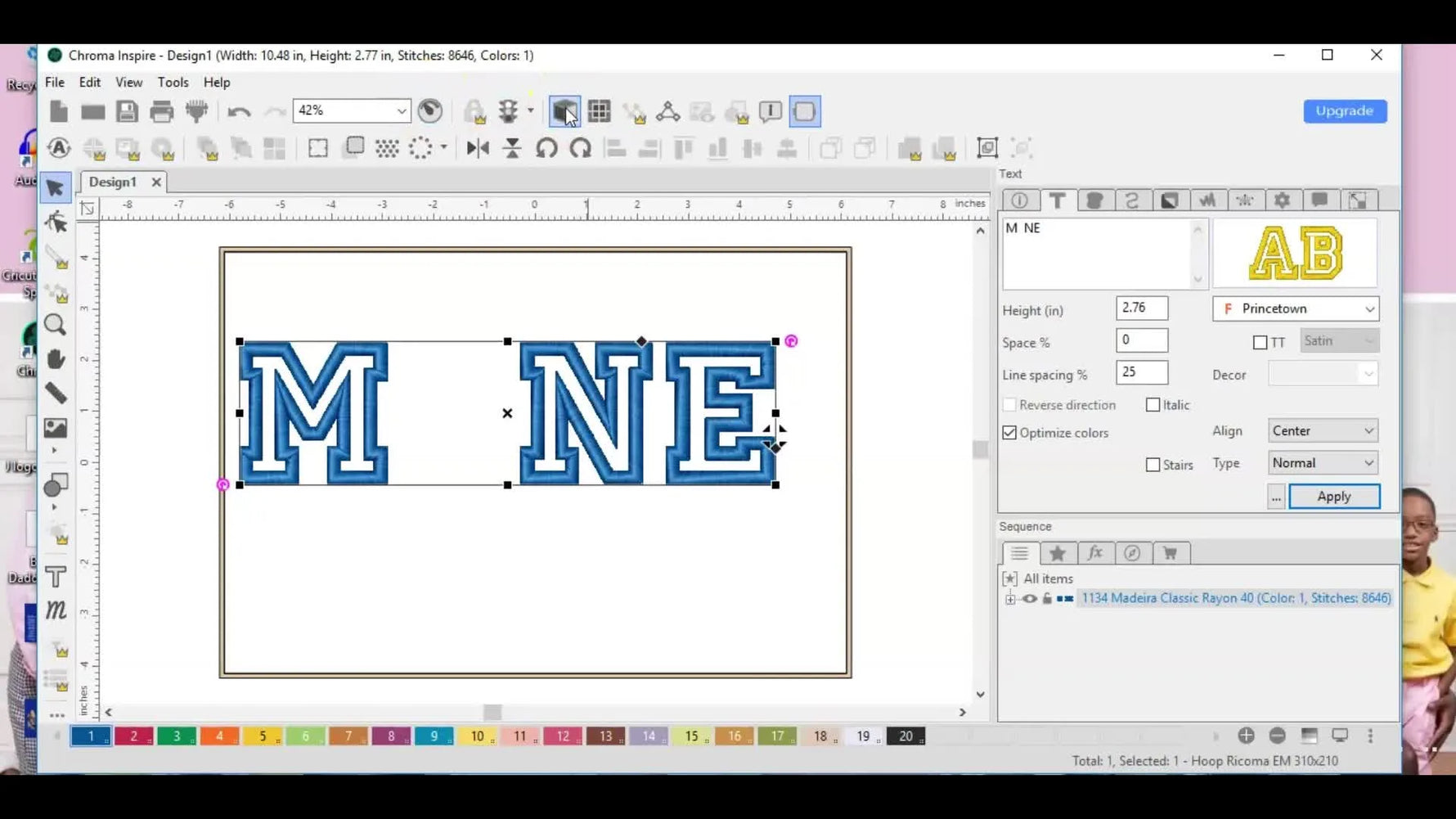 Realistic view of 'M NE' letters with blue satin borders, ready for a fill stitch.
