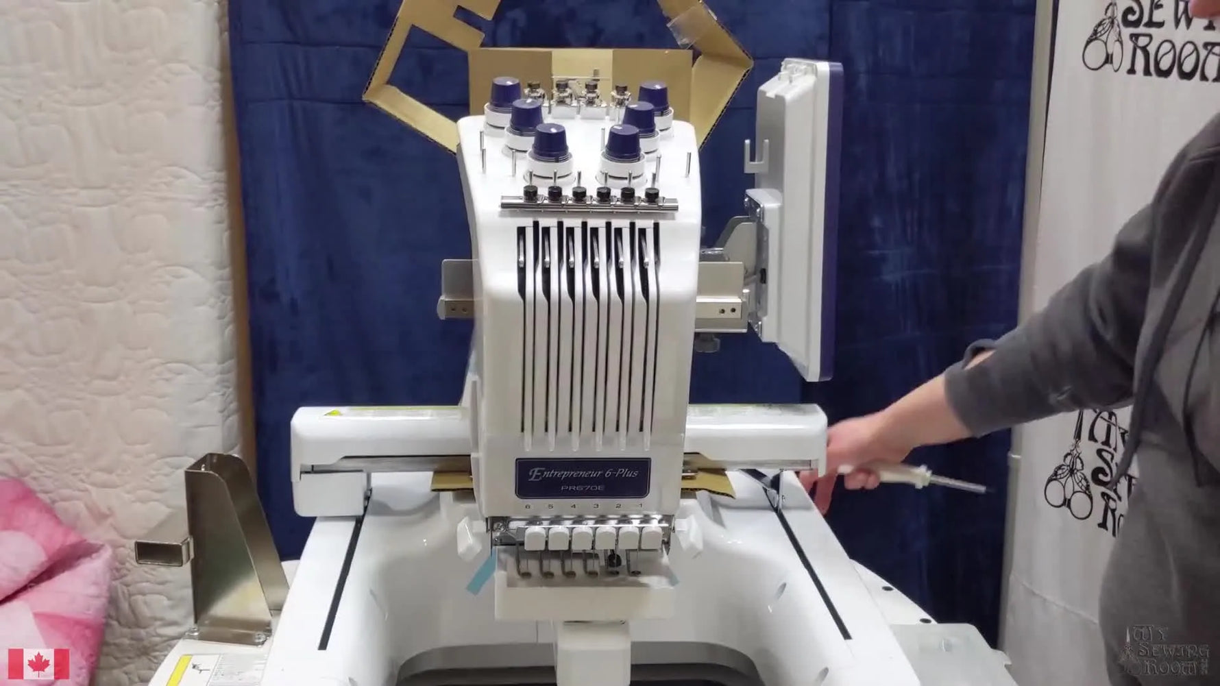 A fully revealed Brother PR670E sits on a table, ready for its first setup steps after unboxing.