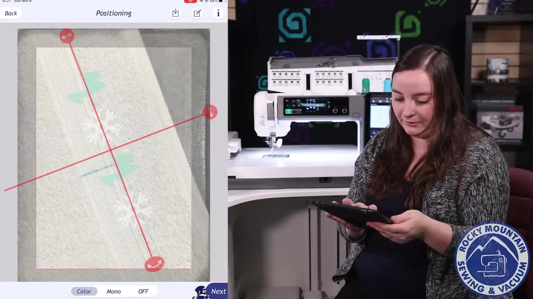 A tablet screen shows the embroidery design being dragged to match a hand-drawn center mark on a hooped towel before sending the corrected placement back to the machine.