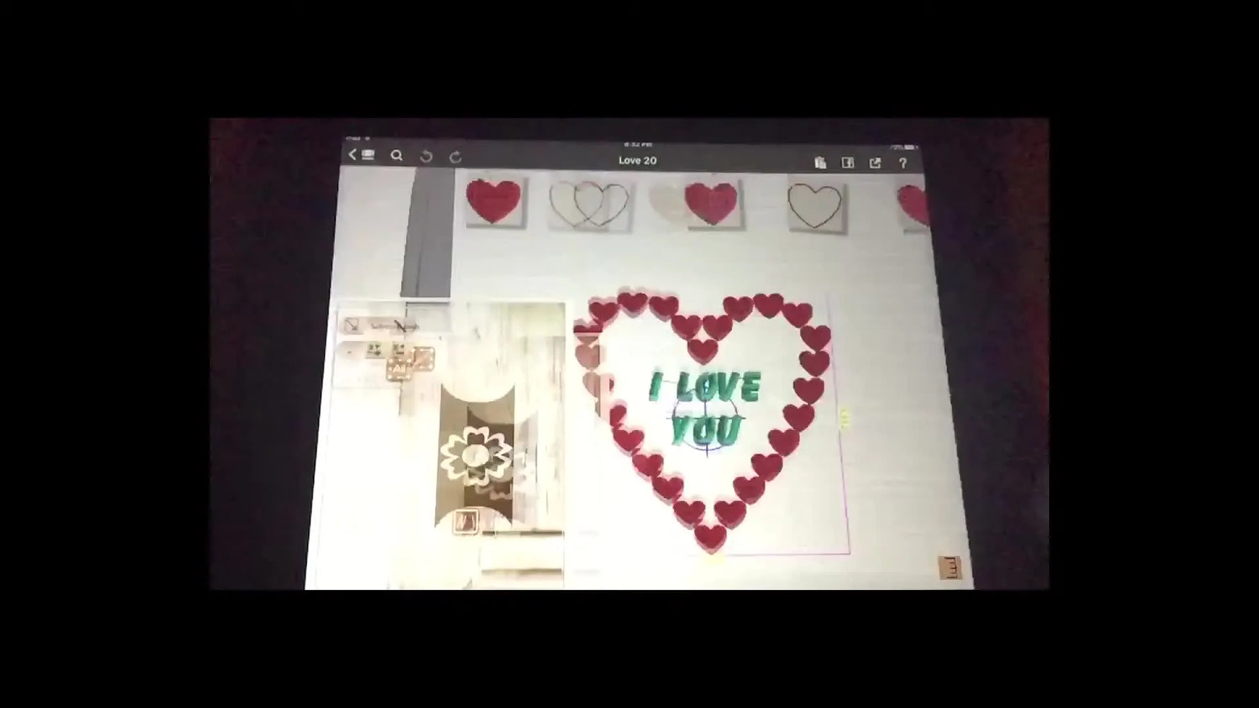 The Janome AcuDesign editing workspace shows a heart design inside the hoop outline with the Clothesline component tiles across the top.