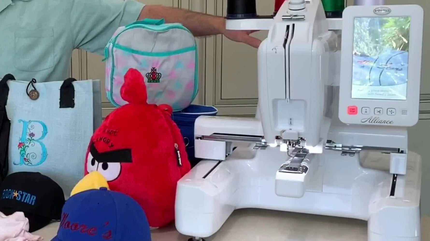 The Baby Lock Alliance on a counter, highlighting the free-arm space designed for tubular items like onesies, bags, and hats.
