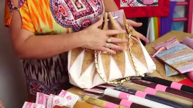 Close-up of a finished patchwork bag combining cork and PU faux leather with clean embroidery details.