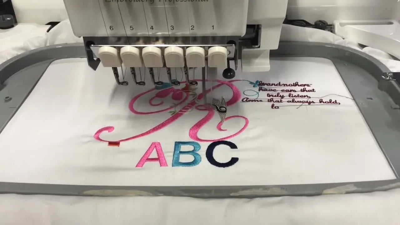 The Baby Lock EMP6 stitches a design at high speed with multiple needles visible, showing a stable hoop and smooth color changes.