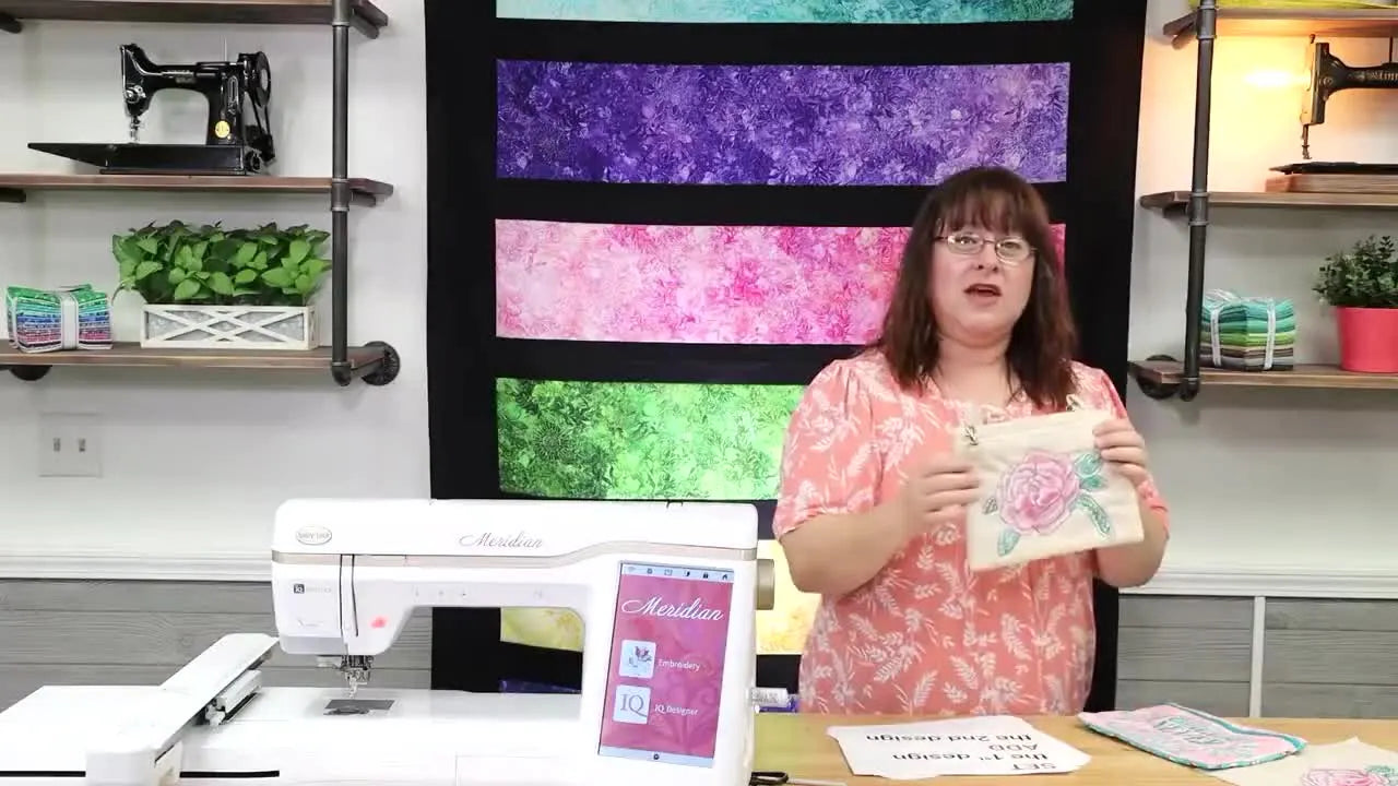 A close-up of the finished zipper bag where the original text has been replaced by a sea turtle embroidery design.