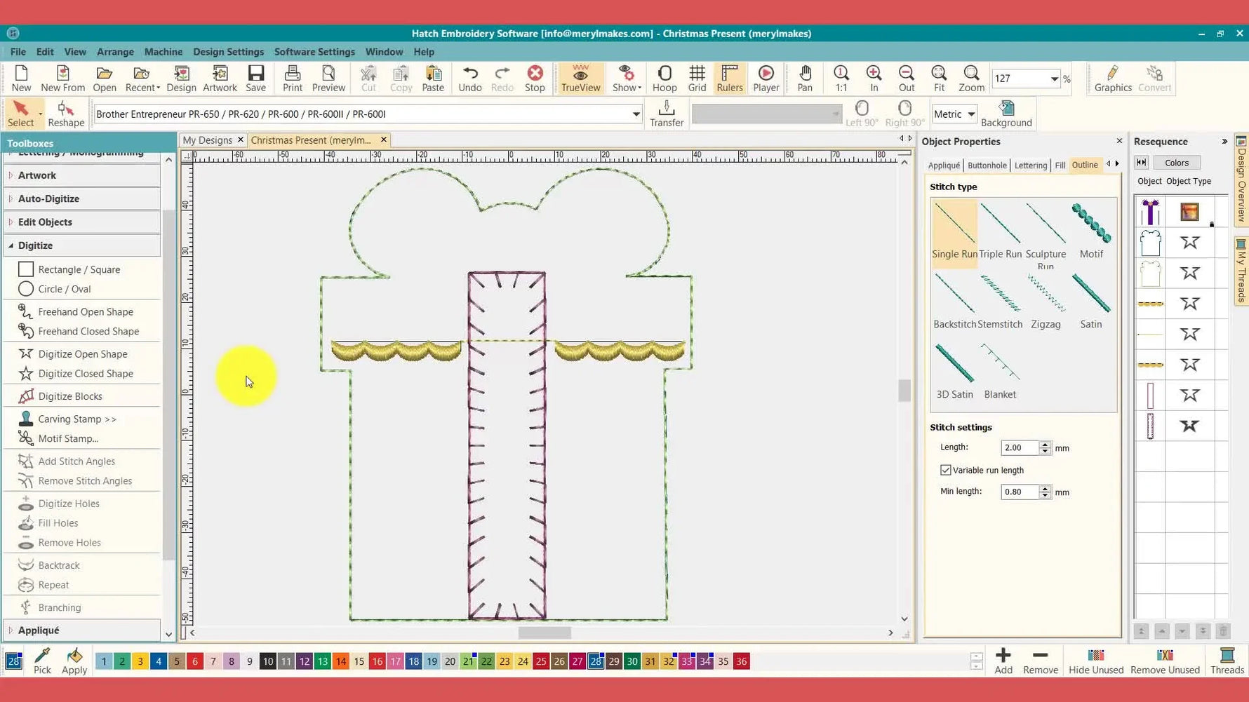 A Hatch screen view with dimmed artwork shows the placement lines and blanket stitch clearly, making the appliqué structure easy to verify before stitching.