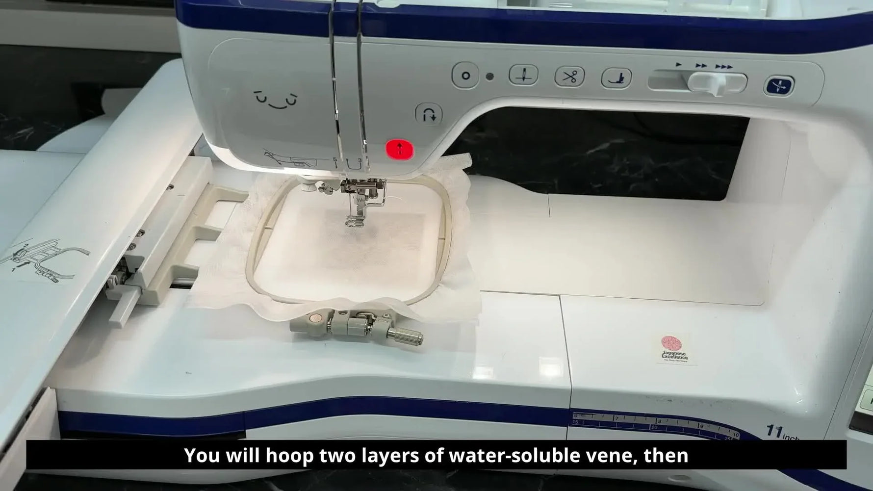 Embroidery machine hoop with two layers of water-soluble stabilizer hooped, ready for stitching.