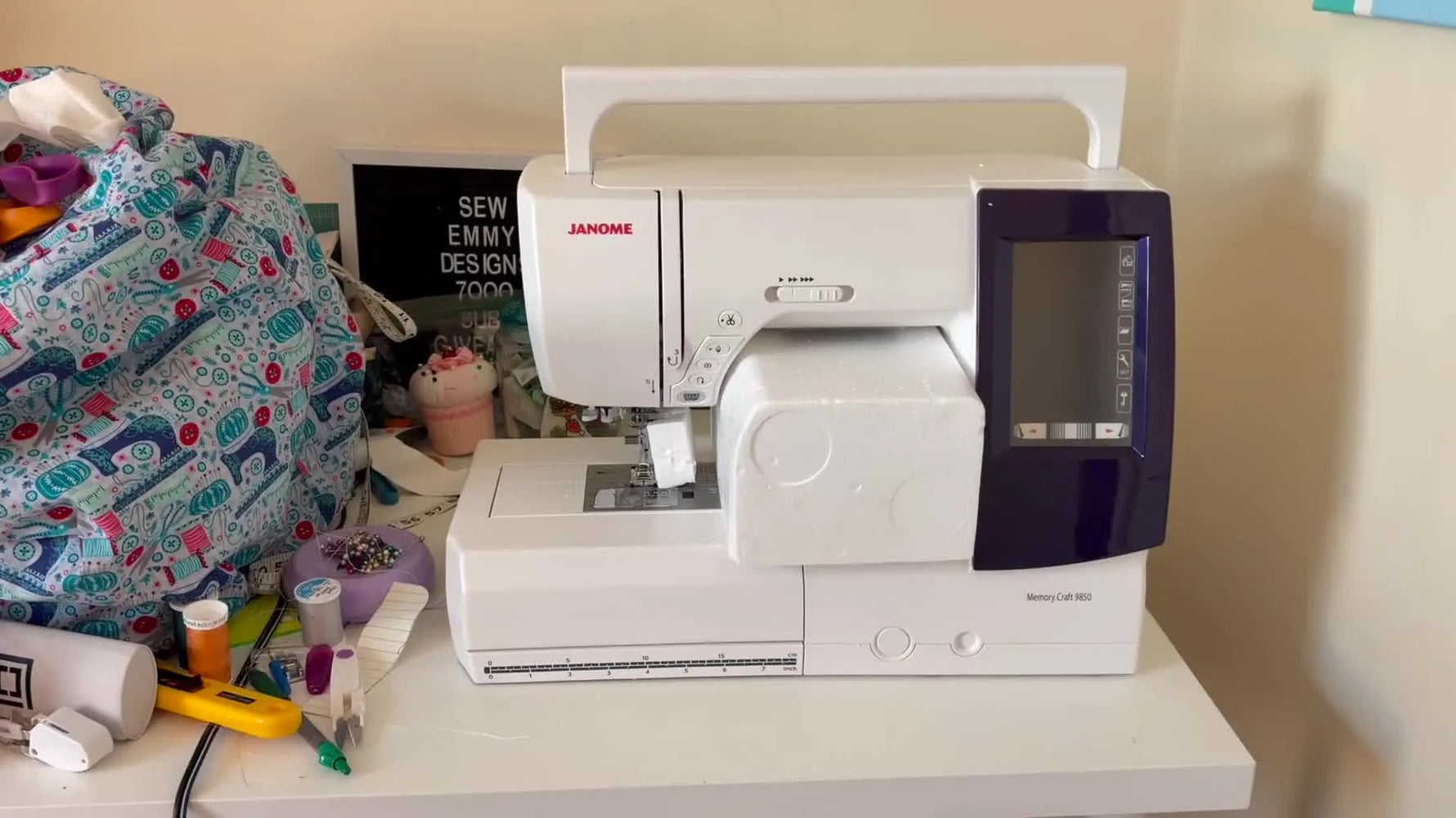 The Janome Memory Craft 9850 sits fully unboxed on a desk, ready for its first power-on and test stitch.