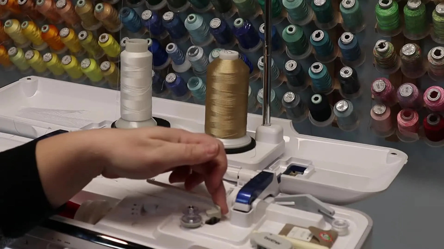 Close-up of engaging the Brother Luminaire 2 XP2 bobbin winder lever to start winding without unthreading the machine.