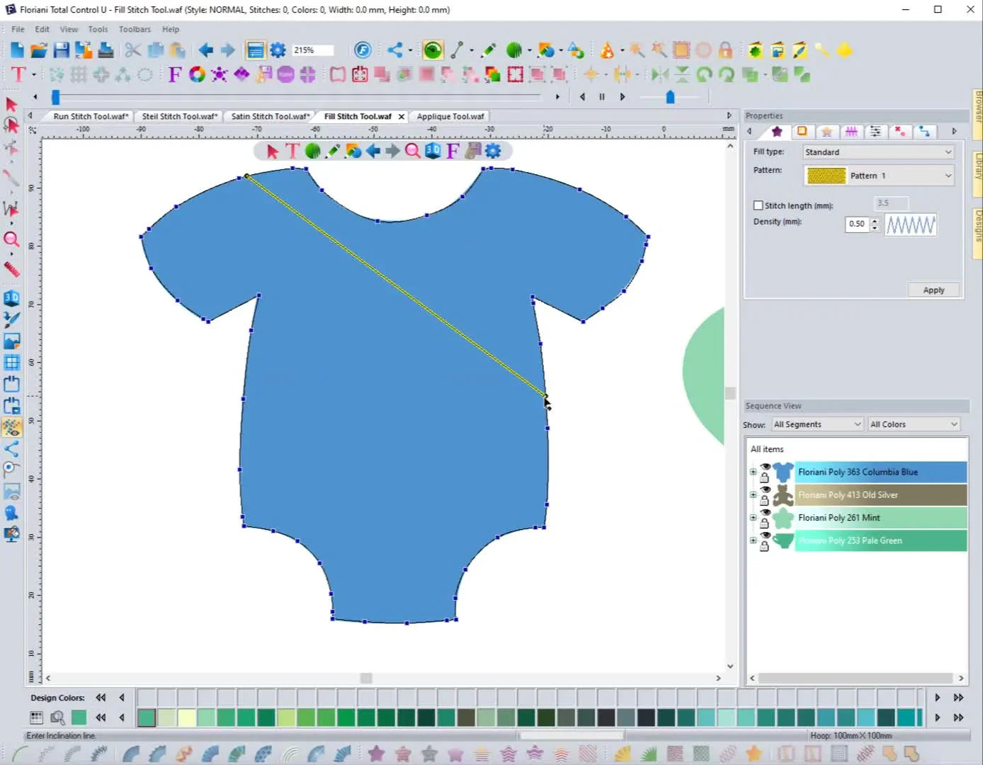 A screen capture in Floriani Total Control U showing a diagonal yellow angle line drawn across a onesie shape to control fill stitch direction.