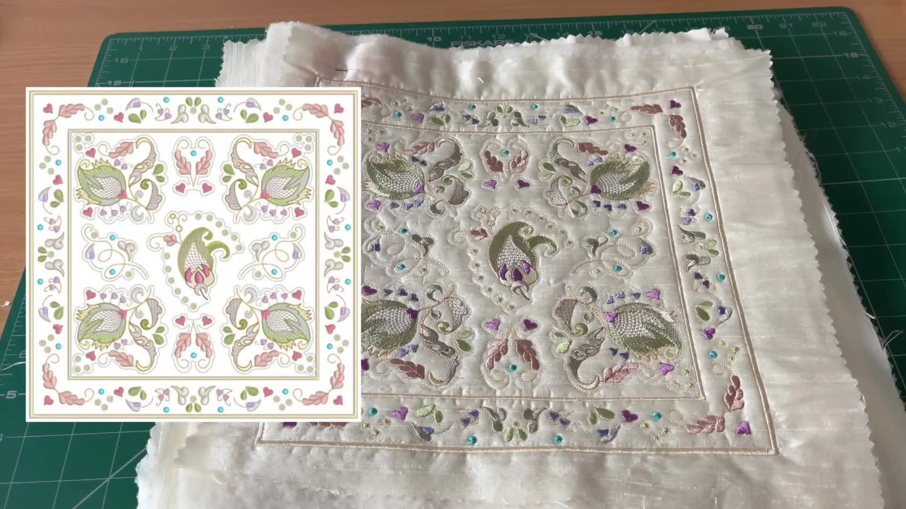 An extreme close-up of a Jacobean quilt block shows crisp heart details and gold thread texture on silk, highlighting the finish quality you’re aiming for.