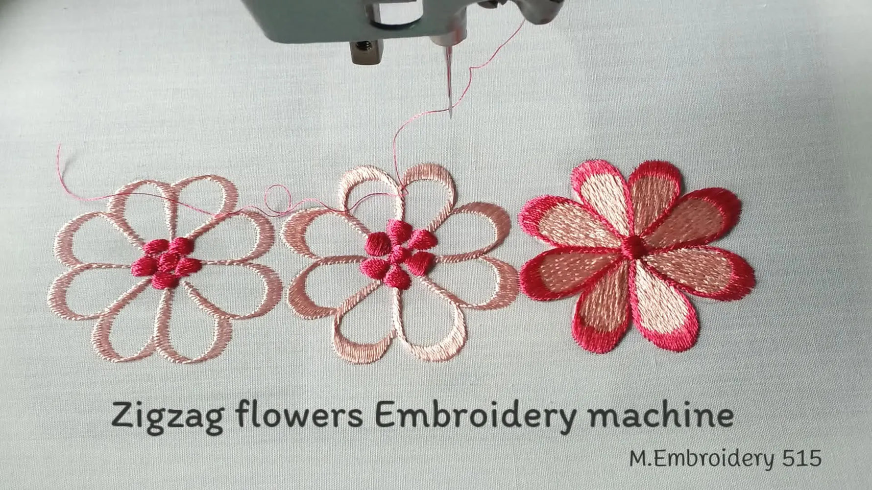 Three completed zigzag flower embroidery designs displayed on white fabric.