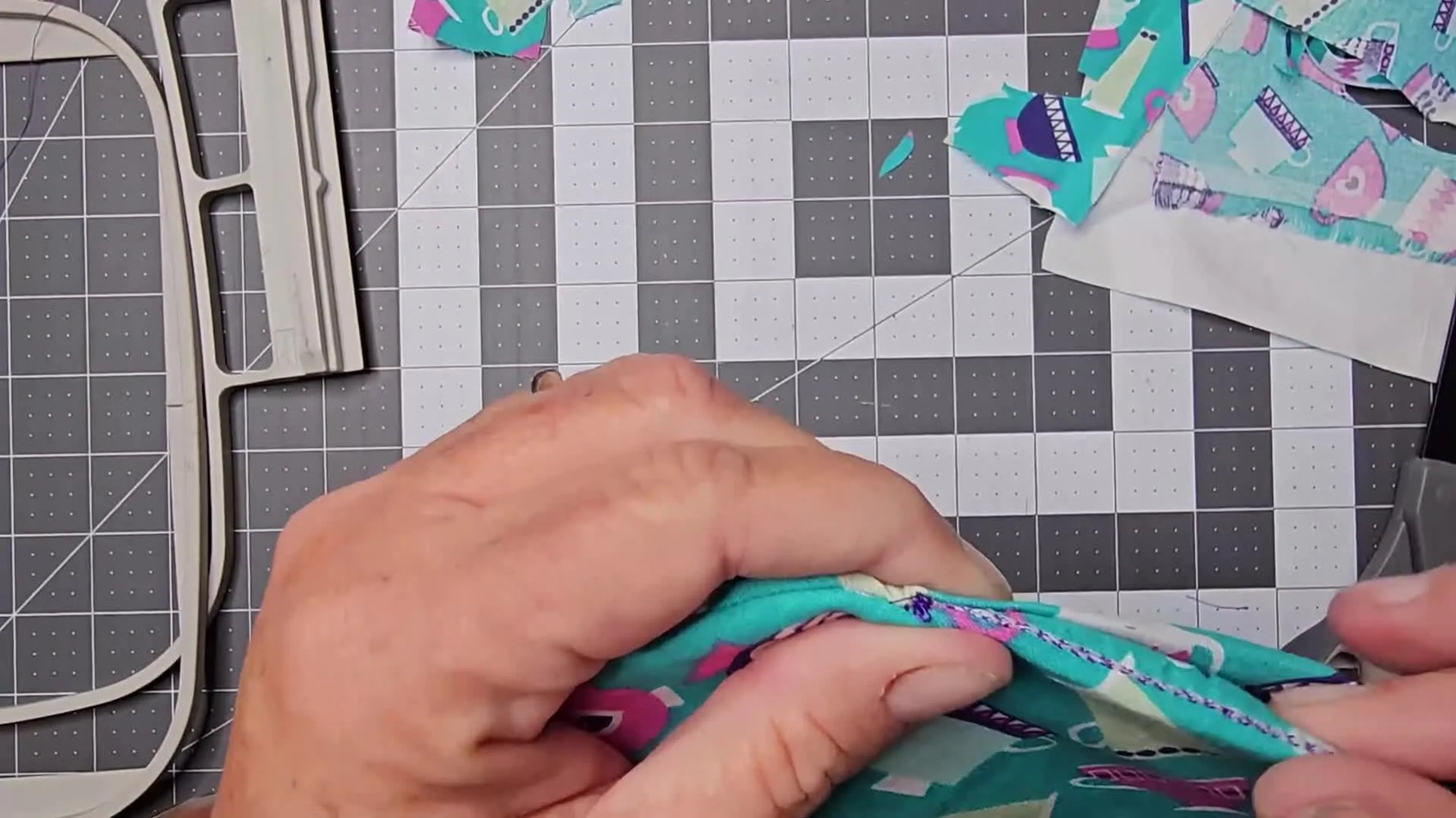 The finished Luna Front Zip bag in woven fabric sits flat on a cutting mat, showing a clean zipper install and fully lined interior.