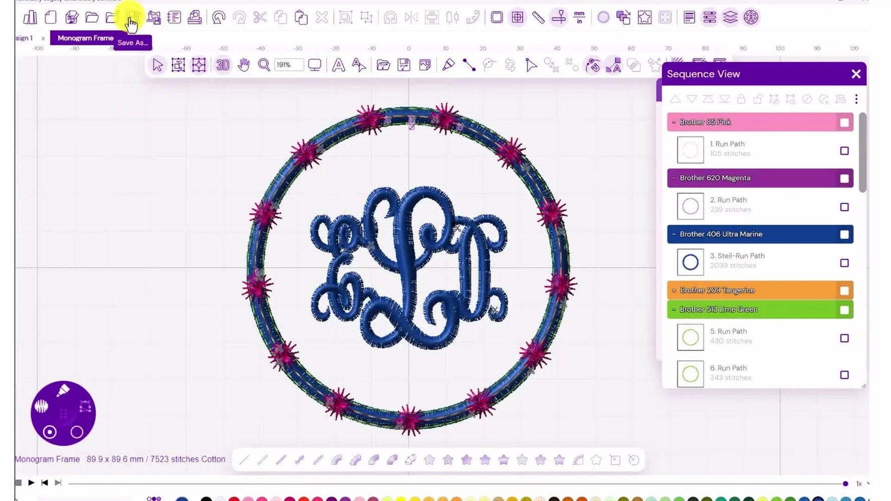 The finished appliqué monogram patch shows an orange center, a blue intertwined monogram, and a pink candlewicking motif ring with decorative borders.