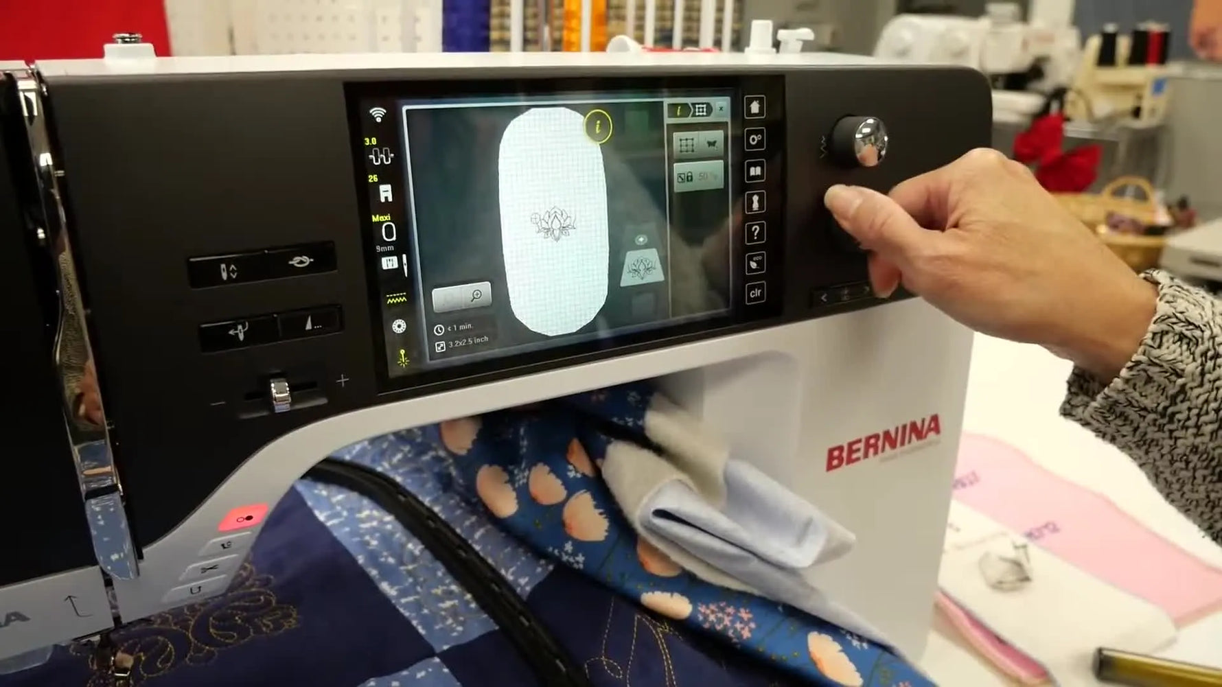 A wide view of the Bernina 790 Pro interface as the multifunction knobs are used to align the needle precisely to a marked center point for Pinpoint Placement.