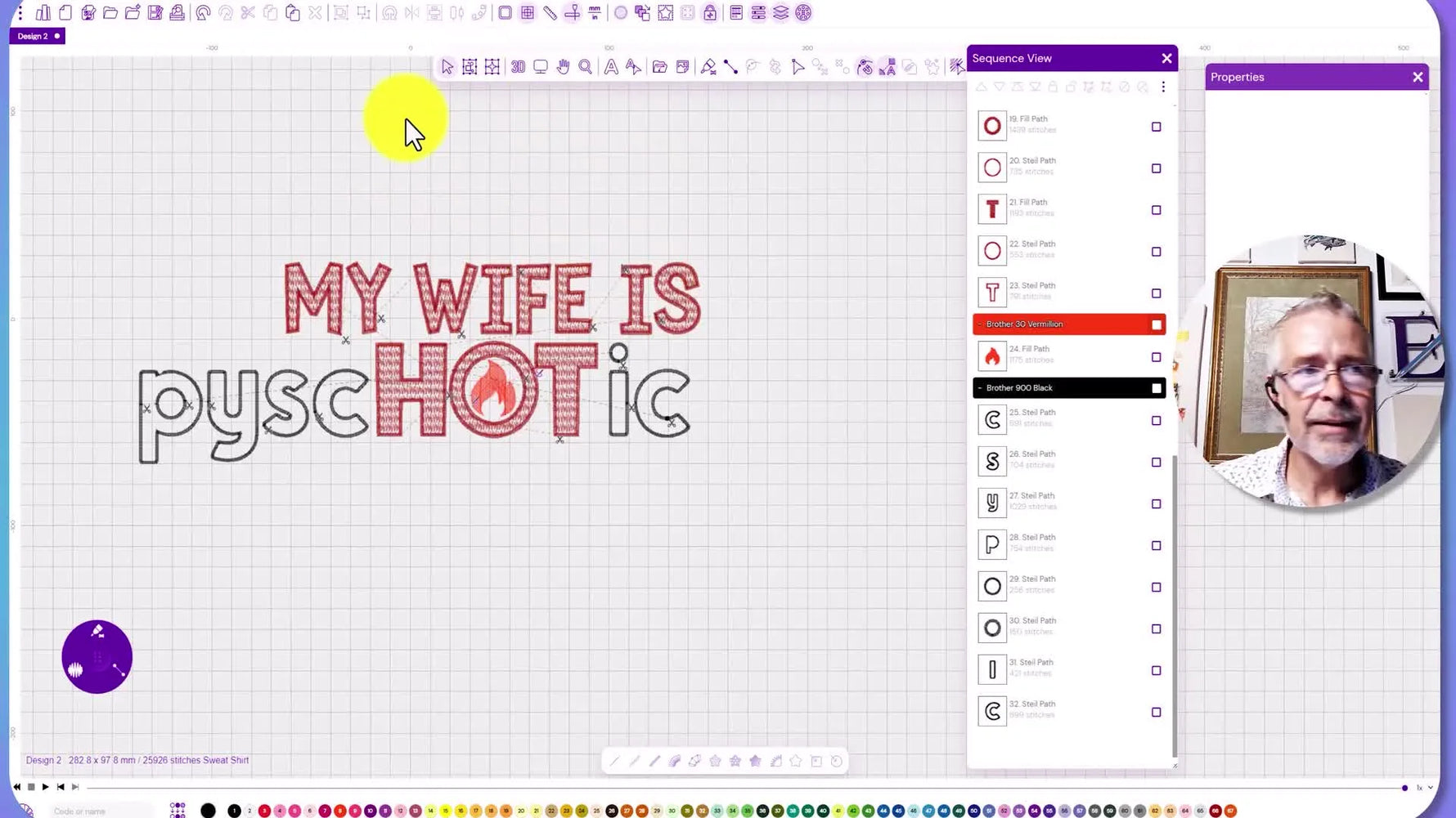 A close-up of the finished embroidered novelty sweatshirt design held up to the camera, showing the final stitch quality and layout.