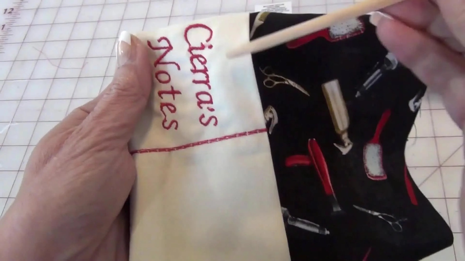 Using a wooden chopstick to push out the corners of the turned fabric project for sharp points.