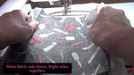 Placing the final backing fabric face down over the embroidery hoop before the final seam stitch.